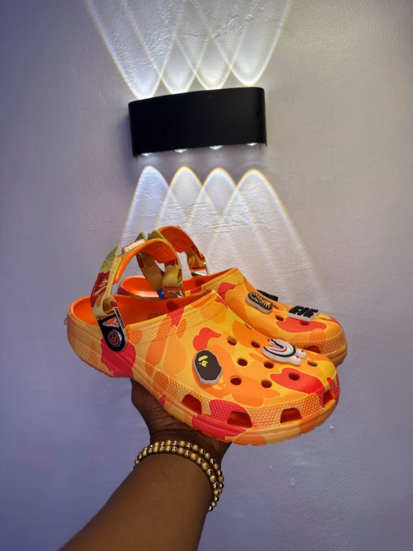 dff4b70e-0250-4c04-888a-863b99dd4044 Orange Camo Charm Clogs
